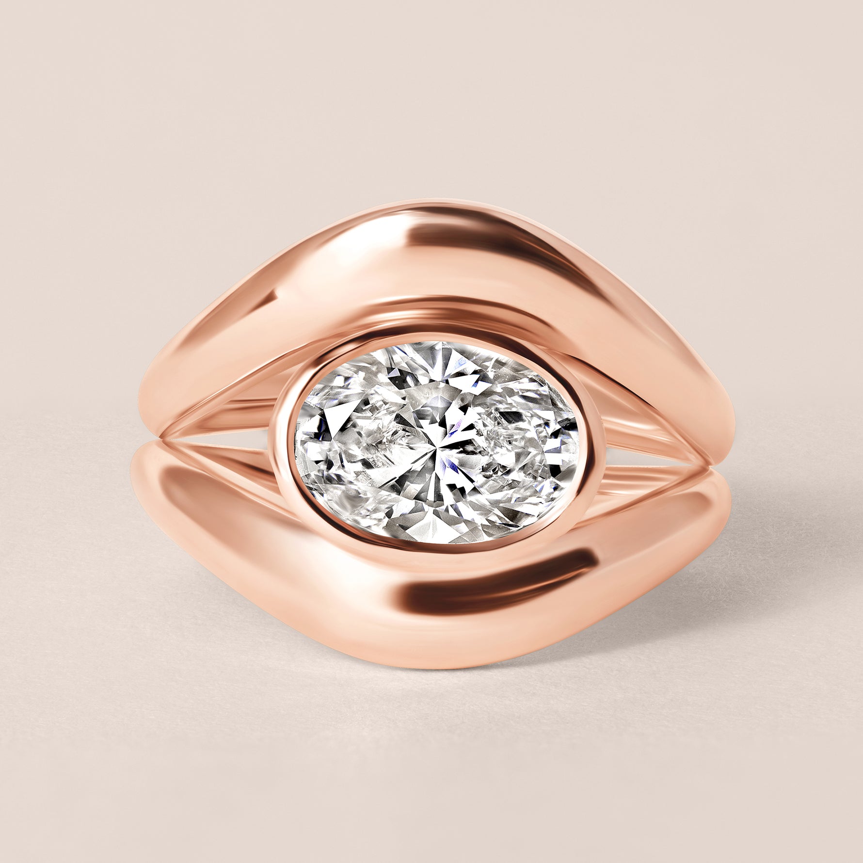 Top-down birds-eye view of Liora oval bezel engagement ring in 18K rose gold paired with a matching plain gold contour band.