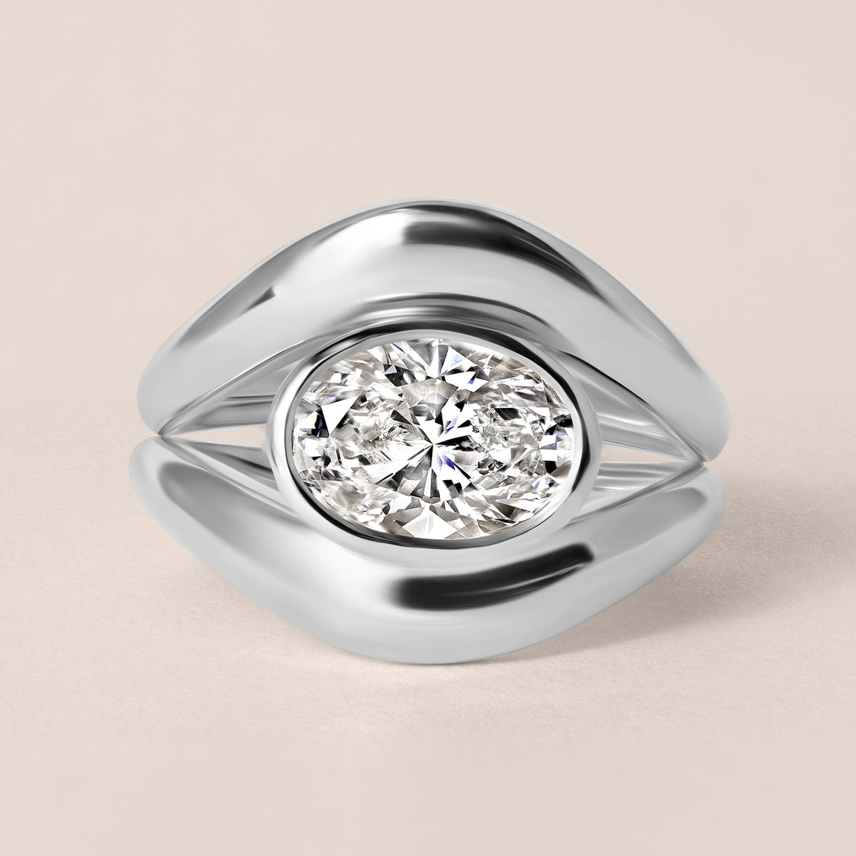 Top-down birds-eye view of Liora oval bezel engagement ring in white gold or platinum paired with a matching plain metal contour band.