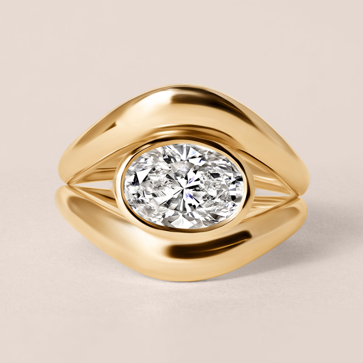 Front view of Liora oval bezel engagement ring in 18K rose gold showing the warm copper tones and horizontal bezel setting.