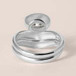 Back view of Liora oval bezel engagement ring stacked with a diamond contour band in white gold or platinum showing structural depth.