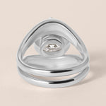 Back view of Liora oval bezel engagement ring stacked with a plain metal contour band in white gold or platinum showcasing the integrated flush fit.