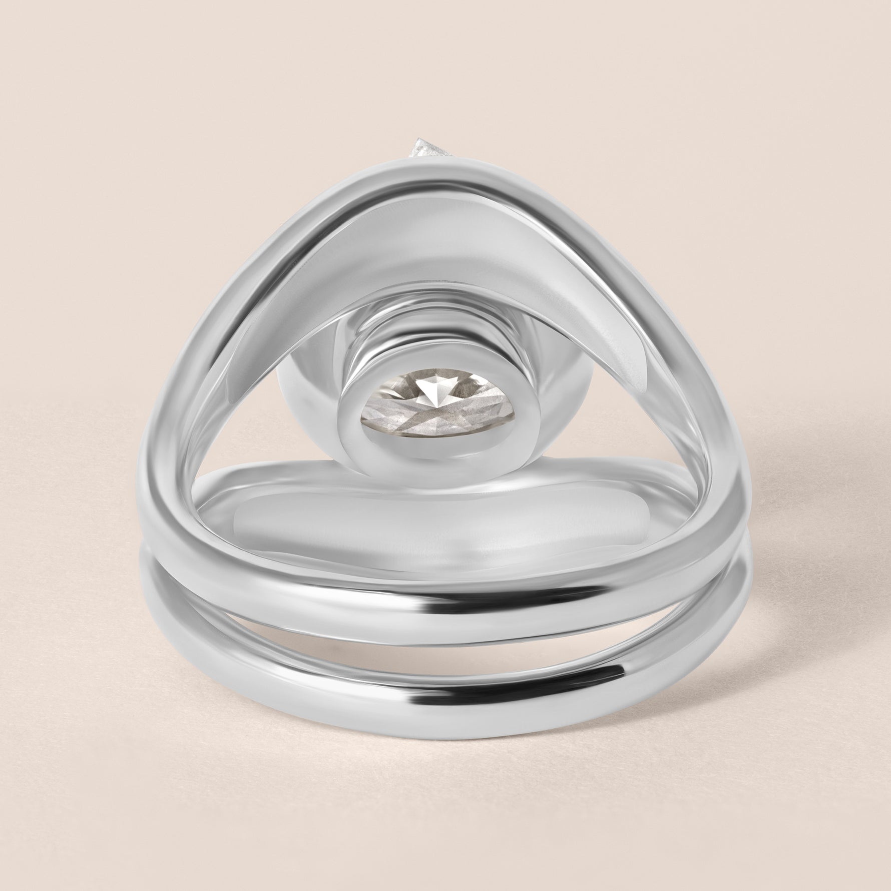 Back view of Liora oval bezel engagement ring stacked with a plain metal contour band in white gold or platinum showcasing the integrated flush fit.