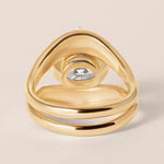 Back structural view of Liora oval bezel engagement ring in 18K rose gold showcasing the solid gold under-bezel architecture.