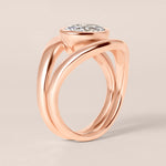Side profile view of Liora oval bezel engagement ring stacked flush with a plain contour band in 18K rose gold.