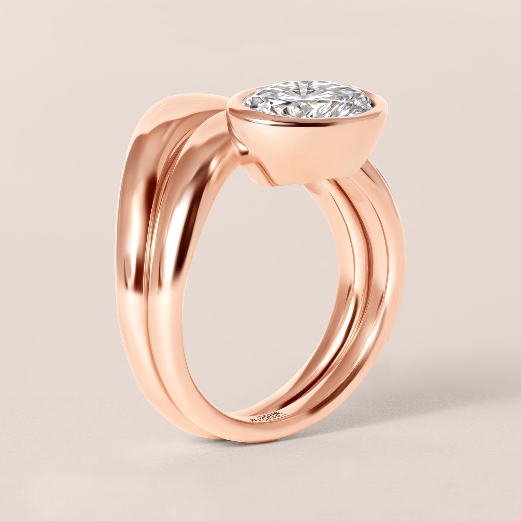 Side profile view of Liora oval bezel engagement ring stacked flush with a diamond contour band in 18K rose gold.