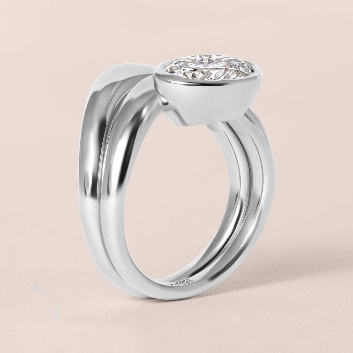 Side profile view of Liora oval bezel engagement ring stacked flush with a diamond contour band in white gold or platinum.
