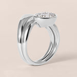 Side profile view of Liora oval bezel engagement ring stacked flush with a diamond contour band in white gold or platinum.
