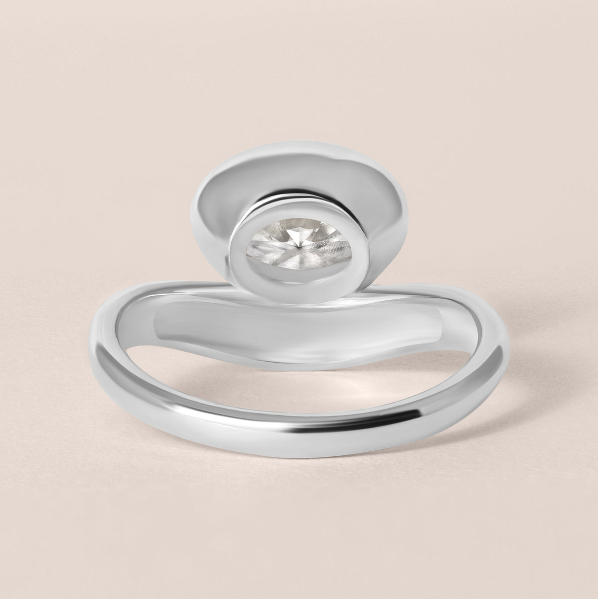 Back structural view of Liora oval bezel engagement ring in white gold or platinum highlighting the inner ring band curvature.