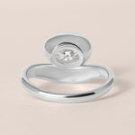 Back structural view of Liora oval bezel engagement ring in white gold or platinum highlighting the inner ring band curvature.