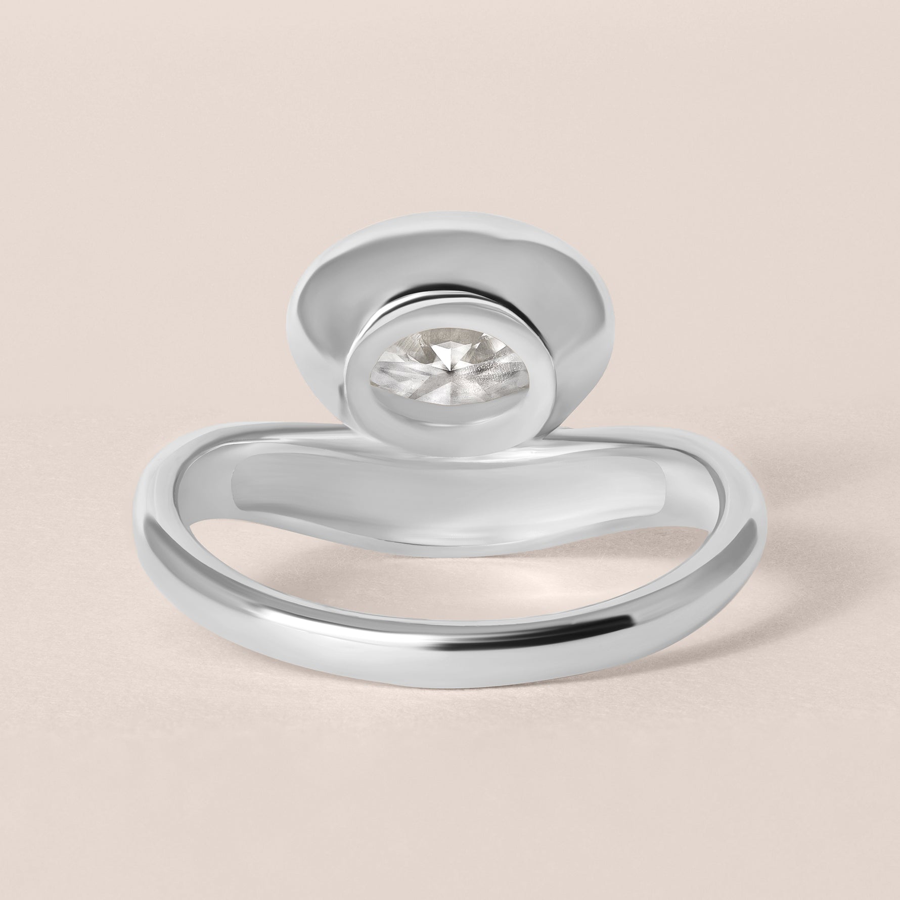 Back structural view of Liora oval bezel engagement ring in white gold or platinum highlighting the inner ring band curvature.