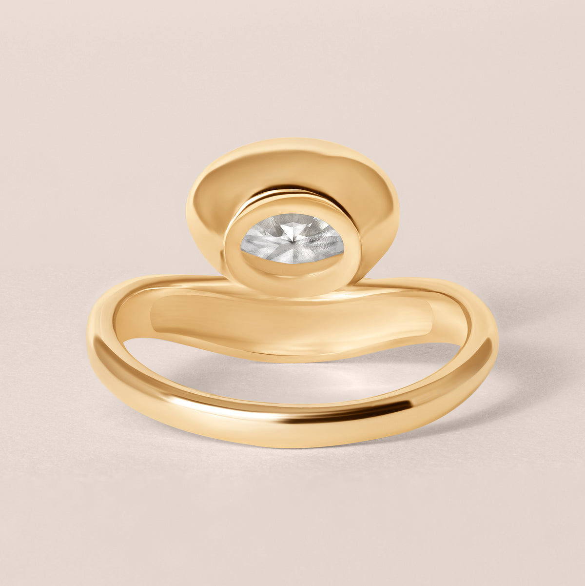 Back structural view of Liora oval bezel engagement ring in 18K yellow gold showcasing the solid under-gallery design.