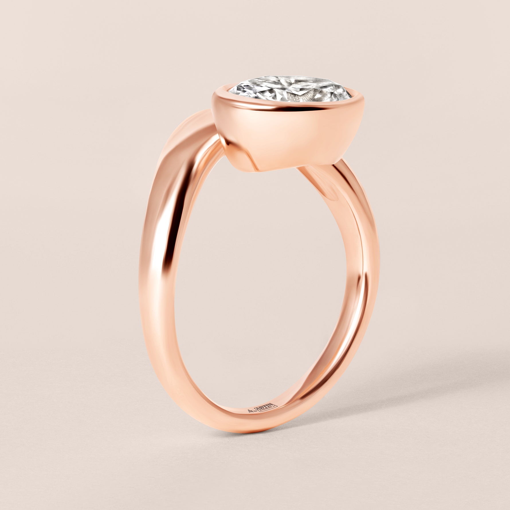 Side profile view of Liora oval bezel engagement ring in 18K rose gold highlighting the fluid architectural setting.